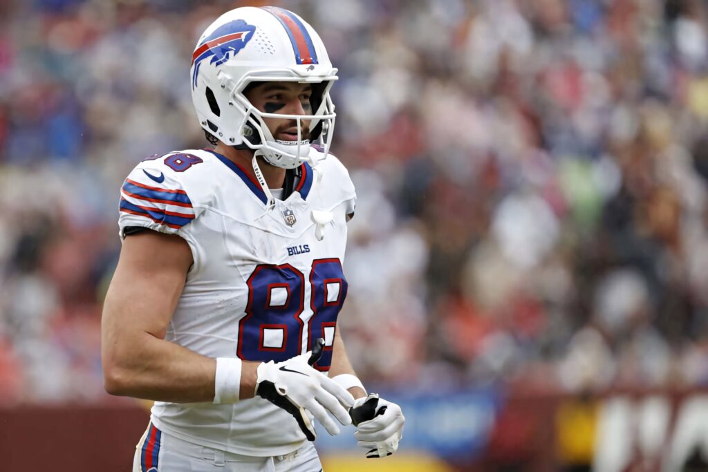 Dawson Knox Buffalo Bills NFL player in white uniform action football field wallpaper background