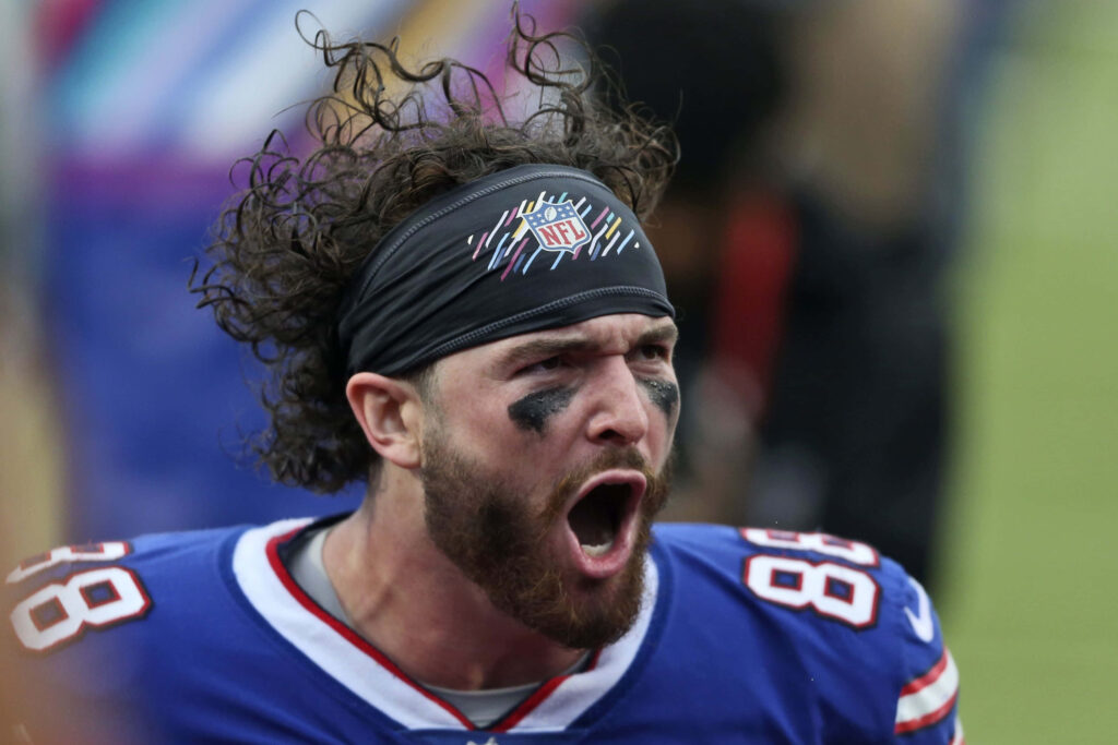 Dawson Knox shouting passionately in Buffalo Bills uniform intense NFL football game action wallpaper