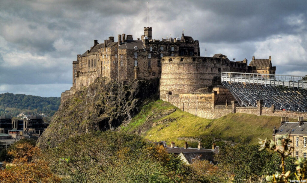 Captivating Edinburgh Castle: A Scenic Side View Wallpaper