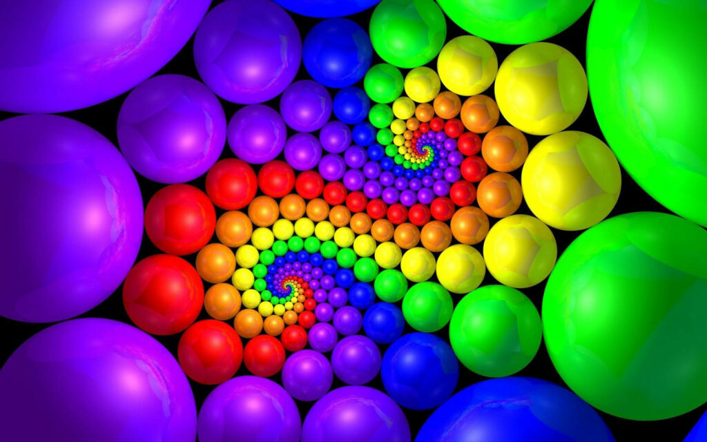 Dazzling Array of Vibrant 3D Balls Forming Hypnotic Spiral Pattern on Ebony Canvas Wallpaper