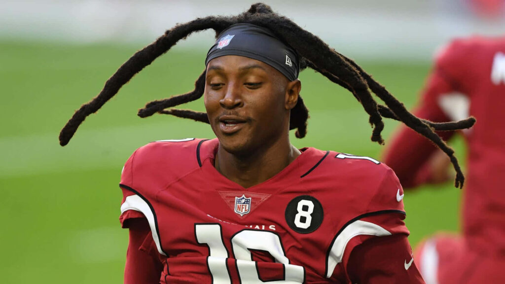 DeAndre Hopkins in Arizona Cardinals uniform catching ball with signature dreadlocks game action Wallpaper