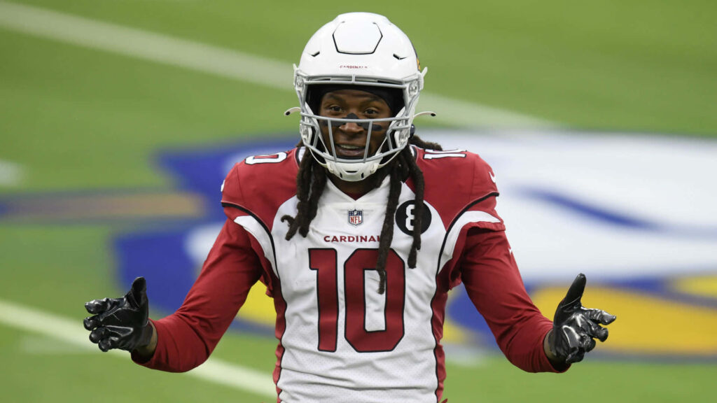 DeAndre Hopkins in Arizona Cardinals red and white uniform mid-game wearing number 10 jersey Wallpaper