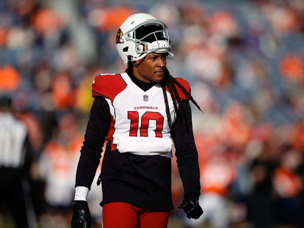 DeAndre Hopkins in Arizona Cardinals uniform on field focused game day football action wallpaper