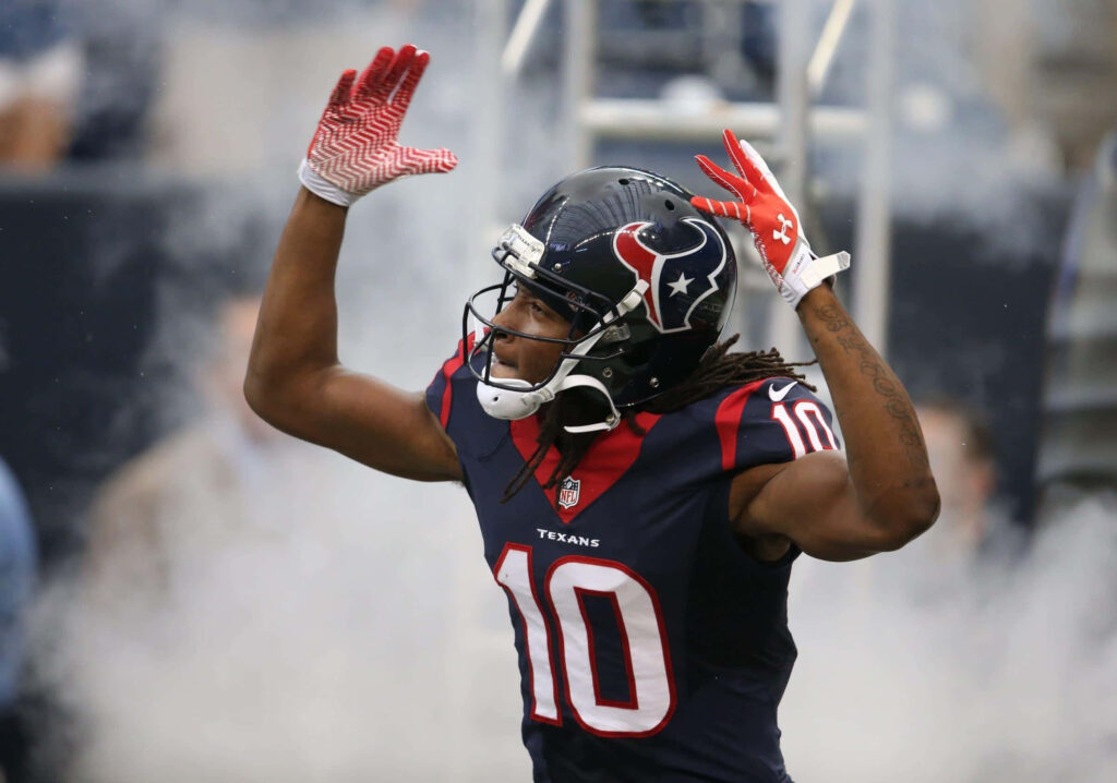 DeAndre Hopkins Houston Texans number 10 celebrating with intense energy and dramatic smoke background Wallpaper