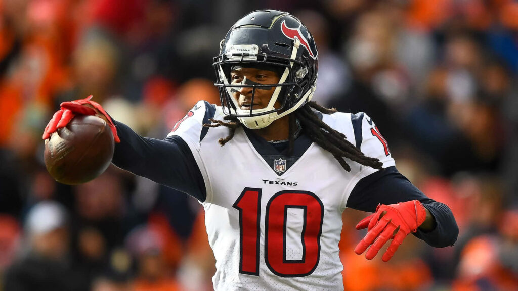 DeAndre Hopkins Houston Texans mid-play action wallpaper showcasing athleticism and focus