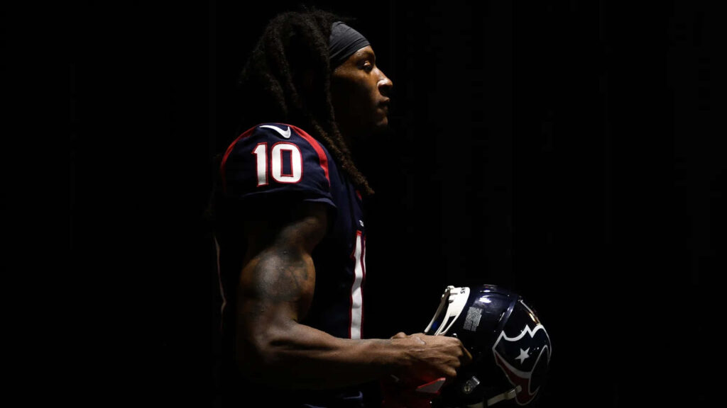 DeAndre Hopkins silhouette in Houston Texans uniform with dramatic lighting football wallpaper background
