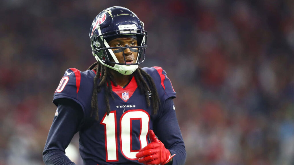 DeAndre Hopkins in Houston Texans uniform focused on field vibrant NFL game day wallpaper background