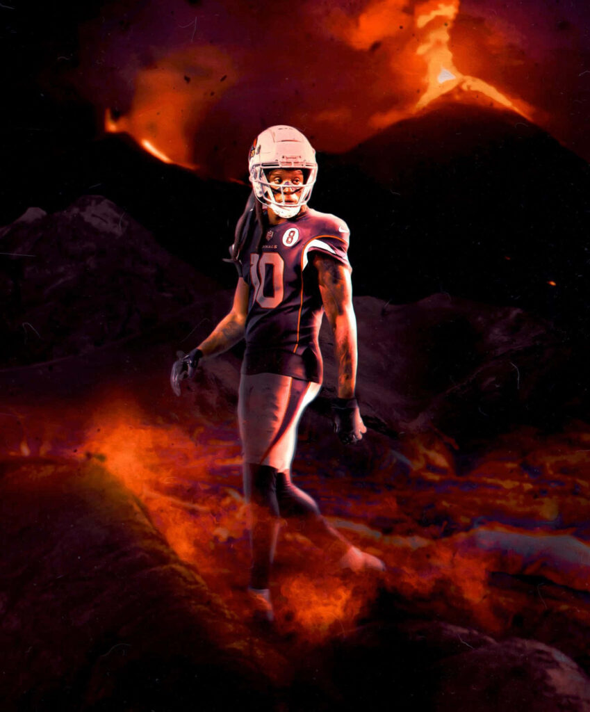 DeAndre Hopkins powerful football pose on fiery volcanic landscape with glowing lava background Wallpaper