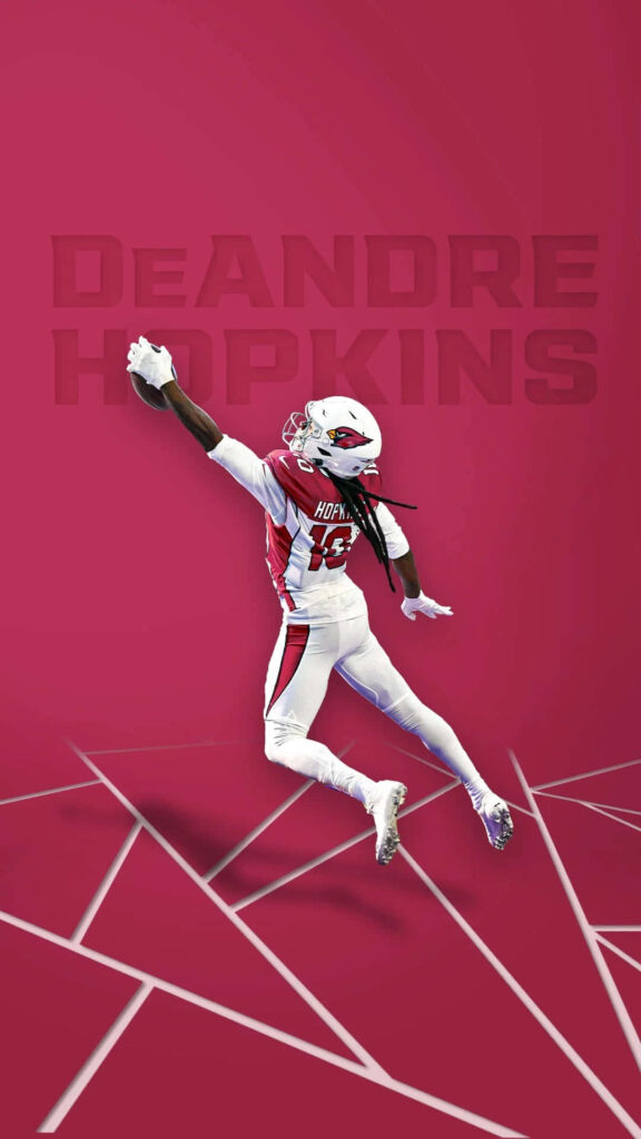 DeAndre Hopkins mid-air catch Arizona Cardinals uniform vibrant red background athletic focus Wallpaper
