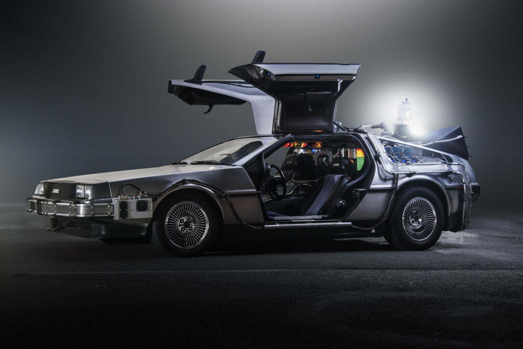 DeLorean Time Machine wallpaper with gull-wing doors and futuristic design on dark background