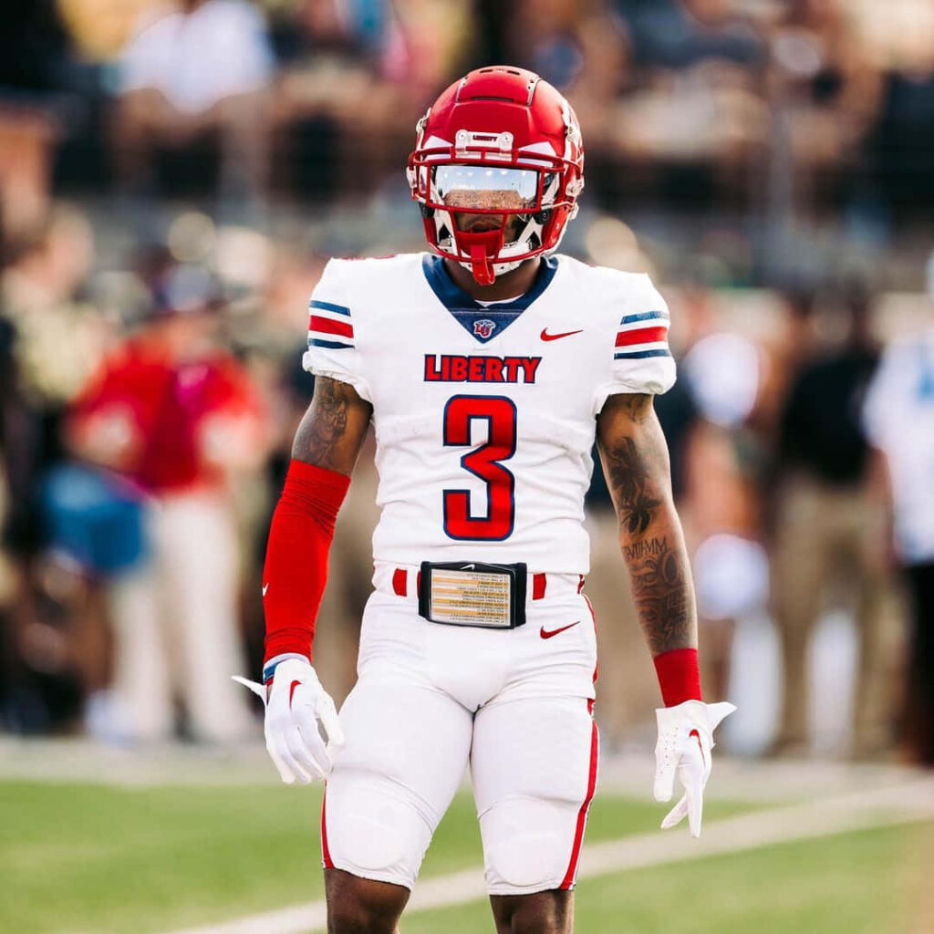 Liberty University football player DeMario Douglas #3 in white red gear action stadium background wallpaper