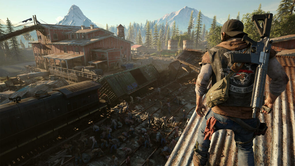 Deacon St John in rugged forested mountains overlooking desolate train yard with rifle ready Wallpaper