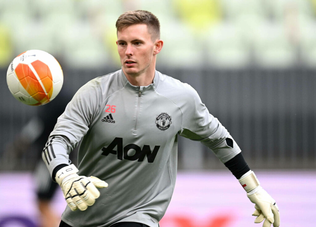 Dean Henderson Manchester United goalkeeper focused in grey training kit ready to catch ball wallpaper