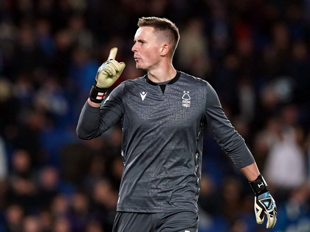 Dean Henderson Nottingham Forest goalkeeper in gray kit shows focus and leadership on pitch wallpaper
