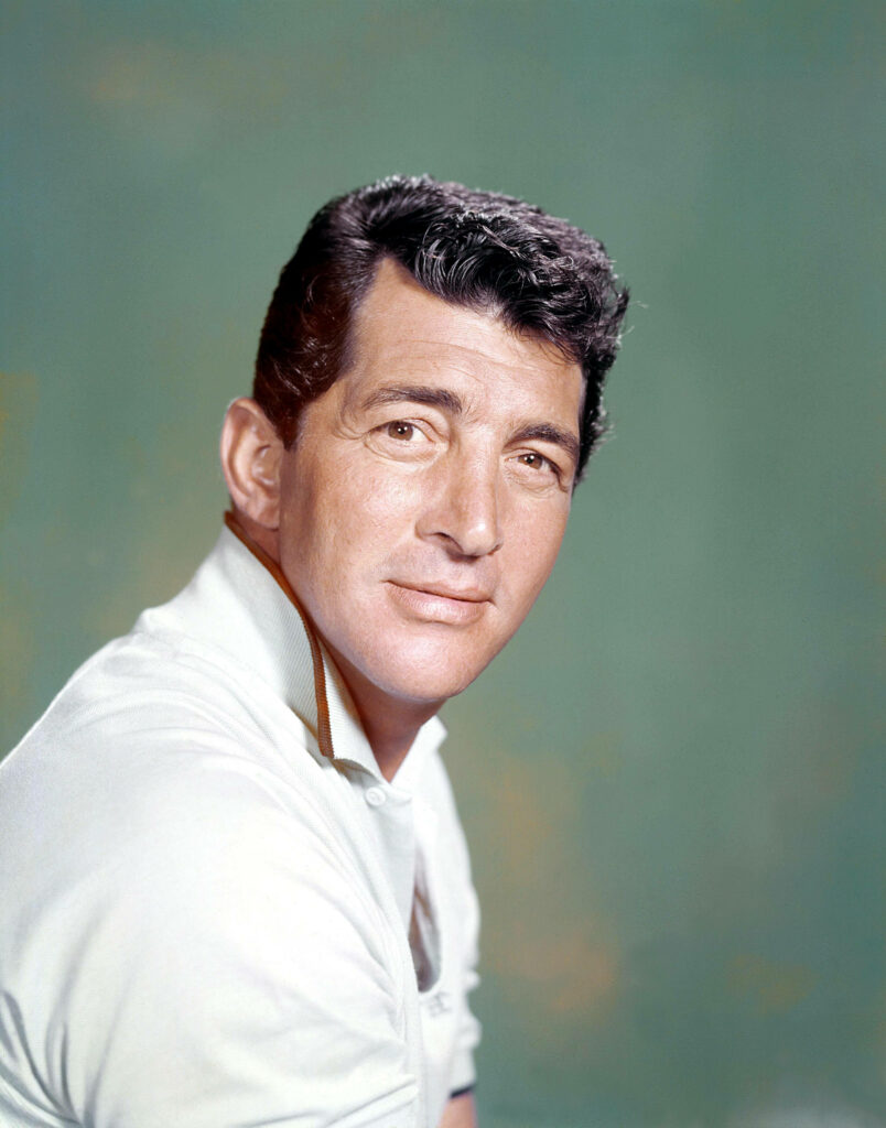 Dean Martin classic portrait with charismatic expression iconic hairstyle soft green background Wallpaper