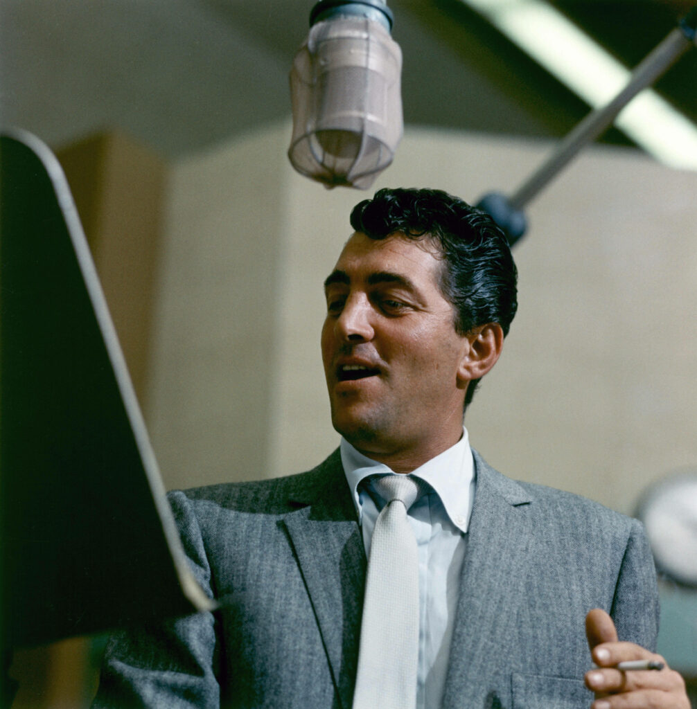 Dean Martin classic studio performance vintage mid century microphone sharp suit wallpaper background
