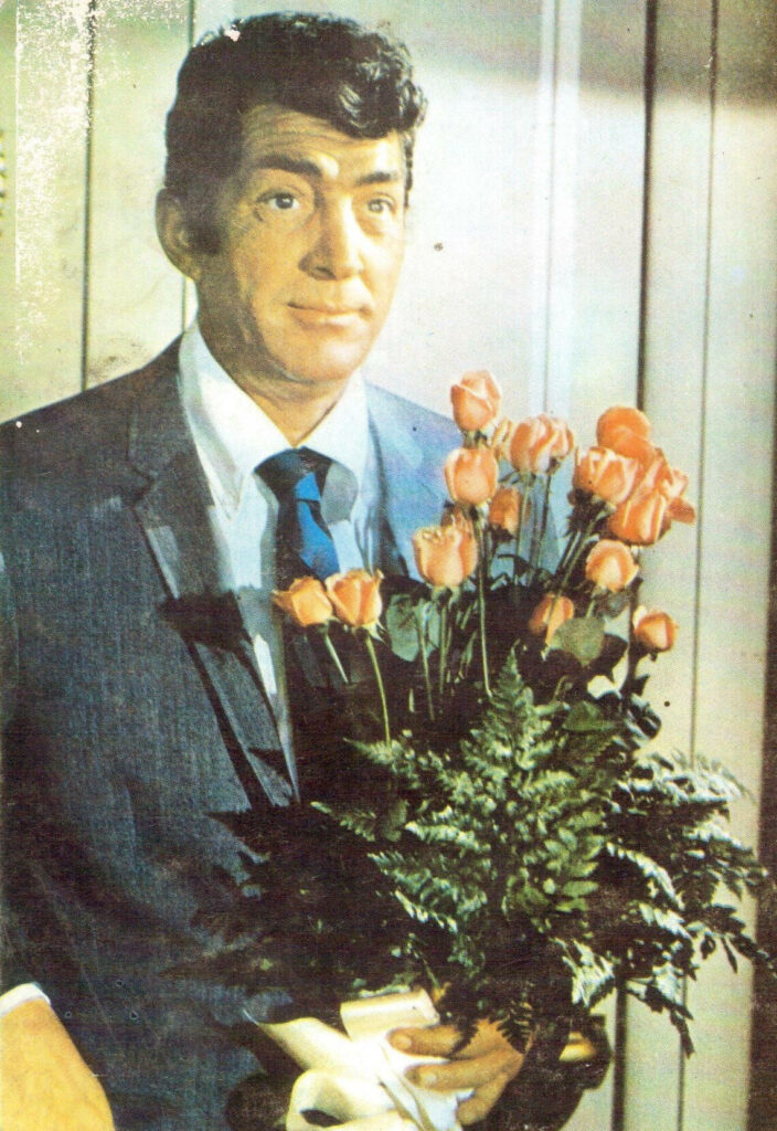 Dean Martin portrait painting in classic suit holding pink roses vintage charming wallpaper