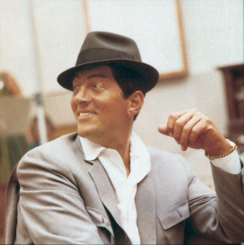 Dean Martin in vintage recording session wearing sharp suit and fedora classic Hollywood charm wallpaper
