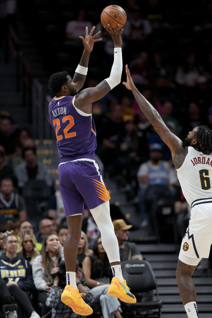 Deandre Ayton Suns elevates for shot against DeAndre Jordan Nuggets NBA Playoffs action wallpaper