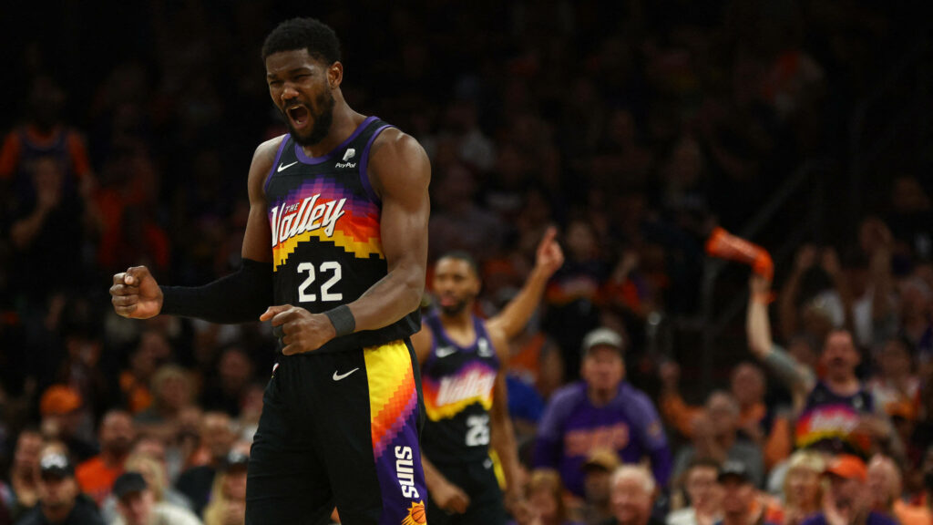 Deandre Ayton Phoenix Suns celebrates in vibrant City Edition jersey with cheering crowd background Wallpaper