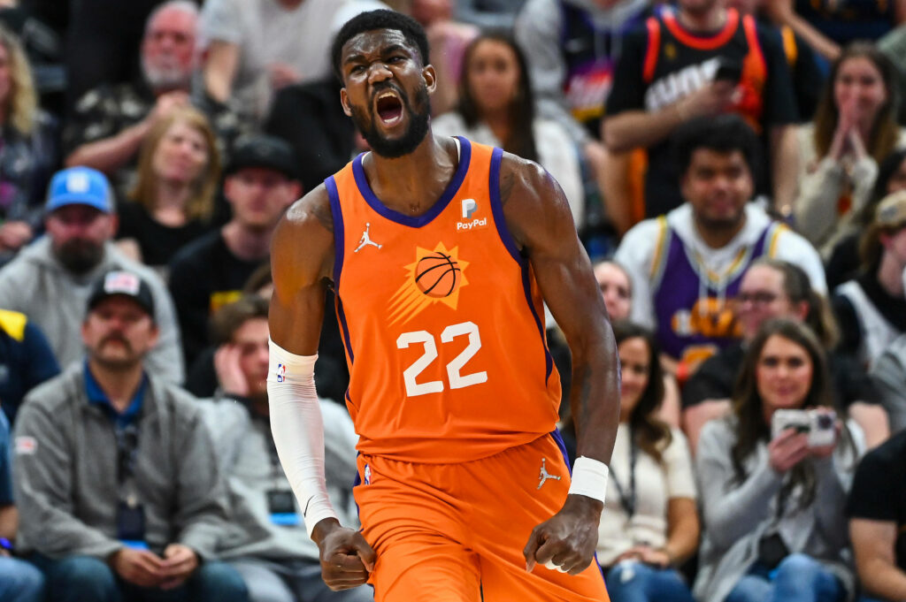 Deandre Ayton Phoenix Suns intense NBA 2022 season action vibrant orange uniform arena fans Wallpaper