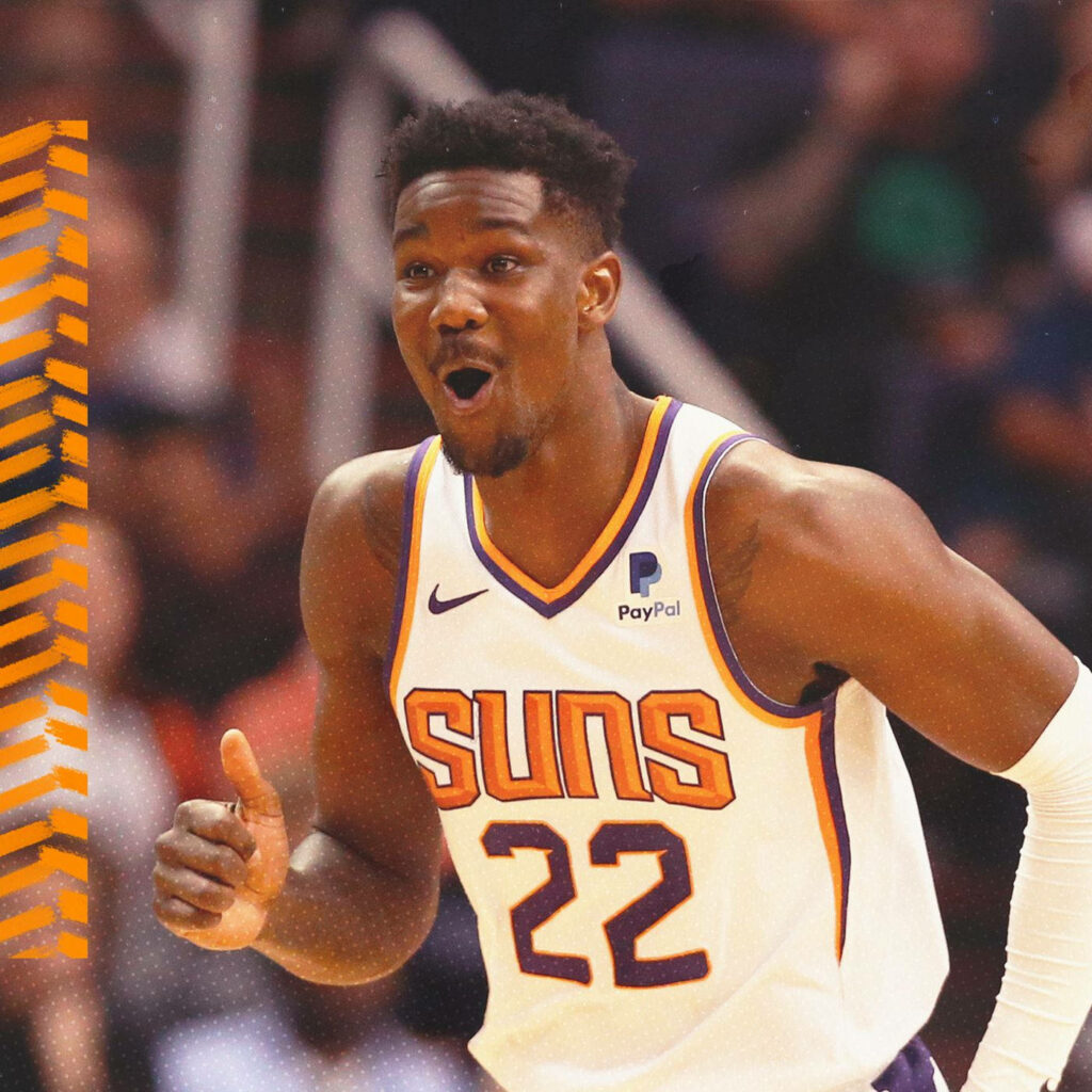 Deandre Ayton mid-action Phoenix Suns white orange uniform dynamic NBA Conference wallpaper background