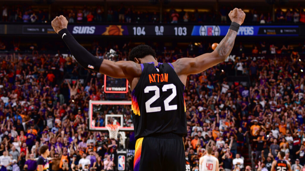 Deandre Ayton Phoenix Suns NBA Finals victory arms raised vibrant jersey electric crowd wallpaper