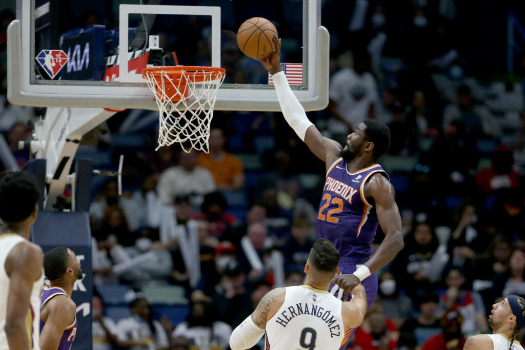 Deandre Ayton Phoenix Suns mid-air alley-oop dunk showcasing athleticism NBA action wallpaper