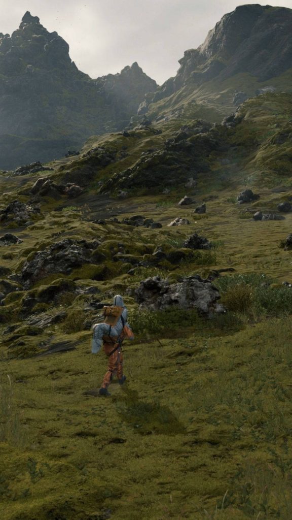 Sam Porter Bridges crosses mossy mountain in Death Stranding iPhone wallpaper realistic CGI background