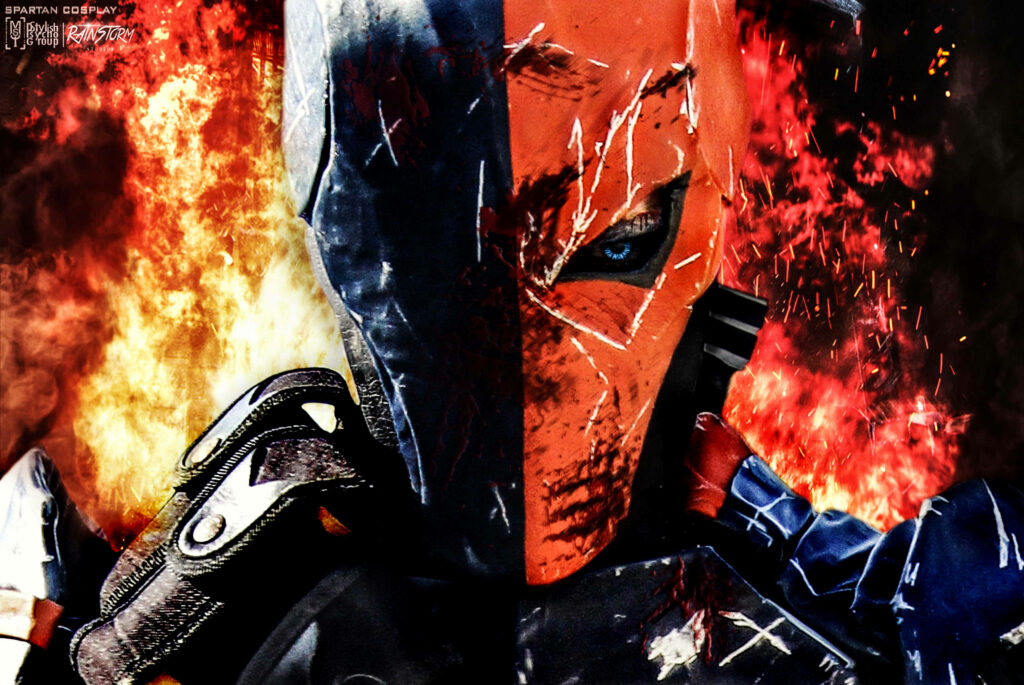 Deathstroke mercenary assassin in orange black mask amid fiery explosions high detail wallpaper