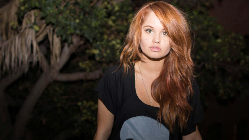 Debby Ryan outdoors with red hair black shirt lush greenery natural night wallpaper background