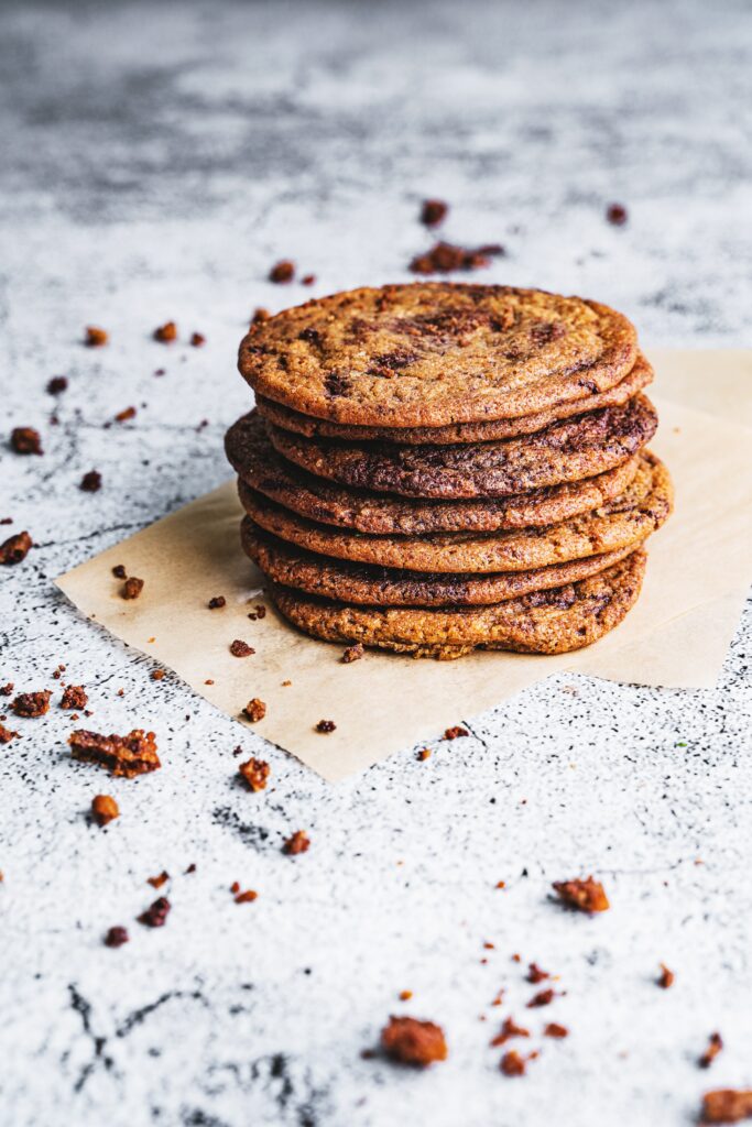 Delicious Brown Chocolate Chip Cookies on Parchment - Wallpaper Background