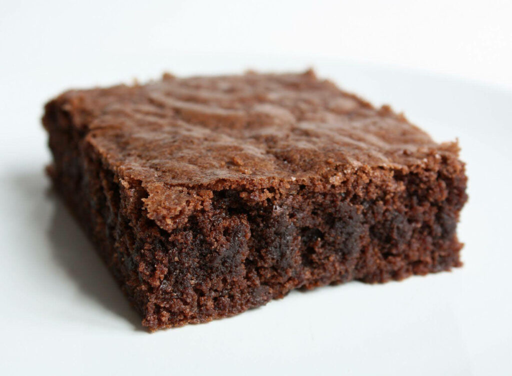 Fudgy chocolate brownie with crackled crust rich dessert high-resolution chocolate wallpaper background