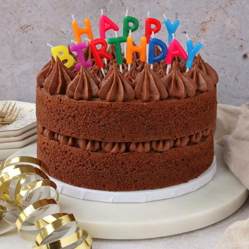 Indulge in a Rich and Decadent Chocolate Delight - Heavenly Chocolate Cake Decorated with Birthday Candles Wallpaper