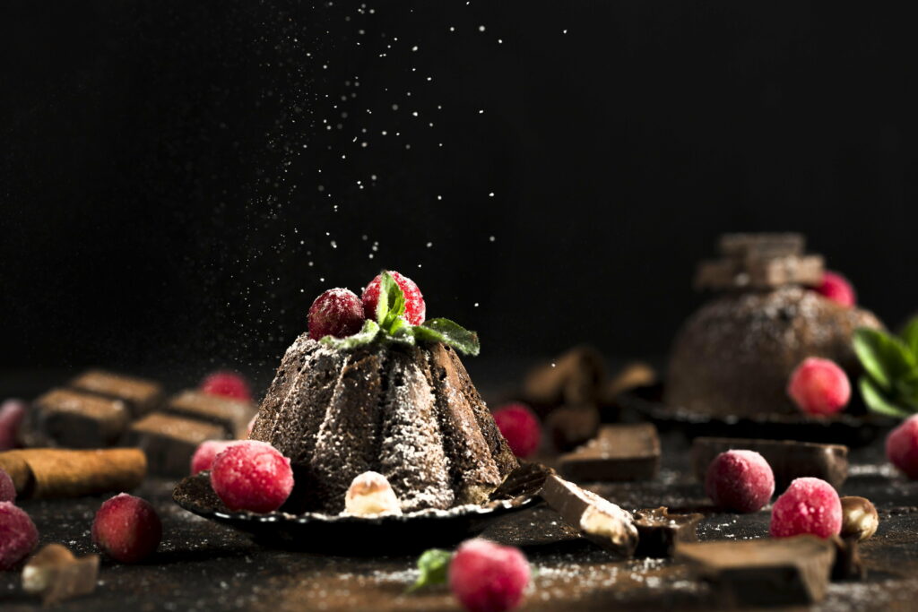 Indulging in Decadence: A Tempting Confection of Chocolate Cake with Raspberry Garnish Wallpaper