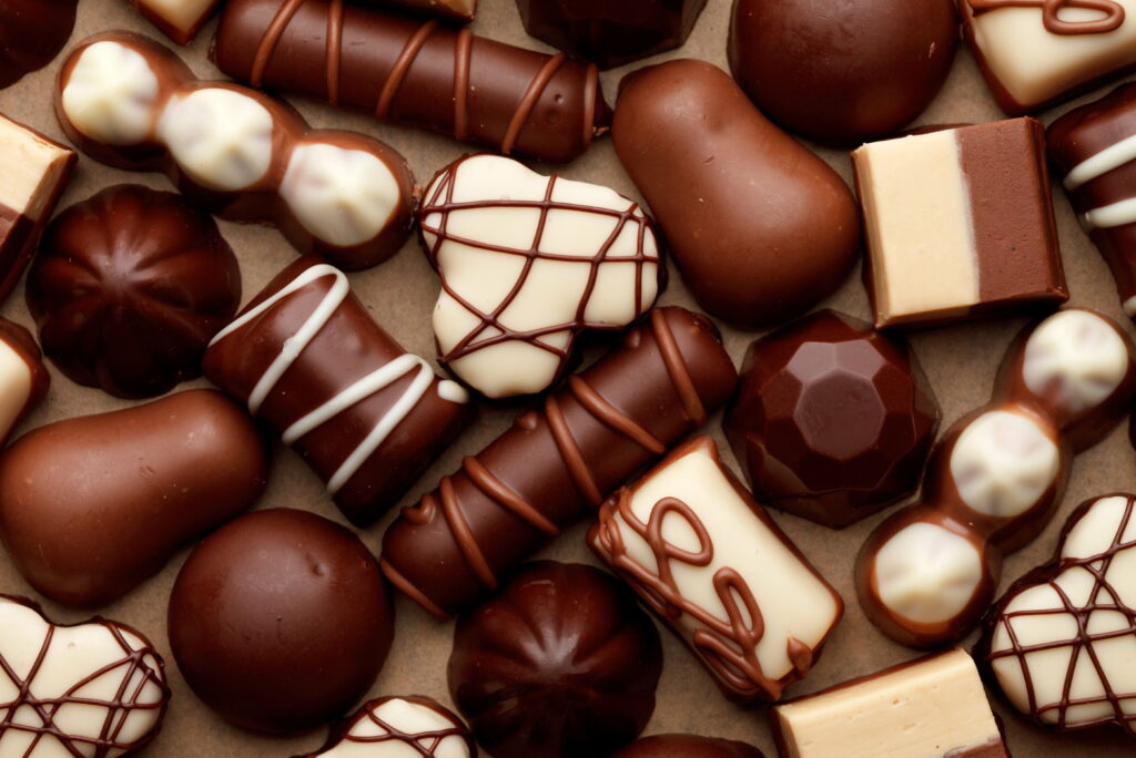 Decadent Delights: A Tempting Array of Assorted Chocolate Treats Wallpaper