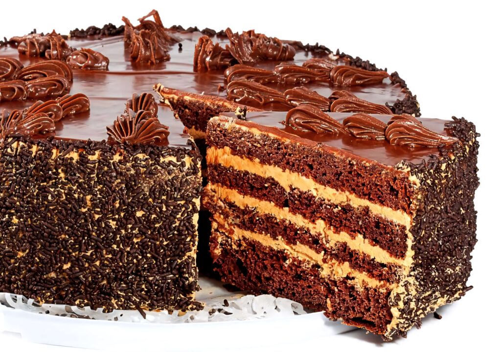Decadent multi-layered chocolate cake with creamy filling glossy ganache and chocolate swirls Wallpaper