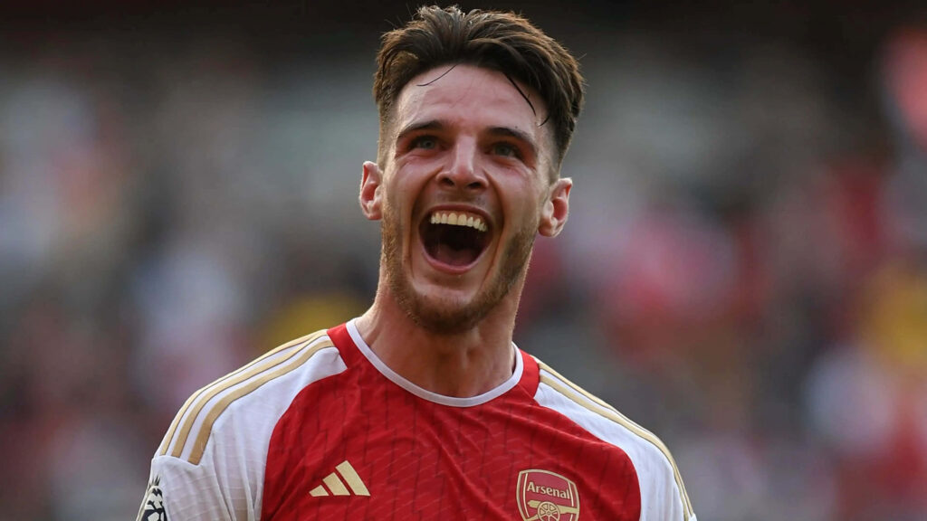 Declan Rice Arsenal kit celebrating passionately close up vibrant soccer victory wallpaper background