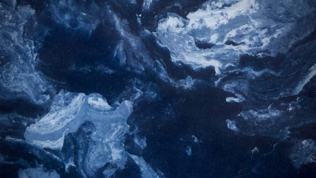 Blue marble wallpaper with navy stone and swirling white azure veins natural texture background