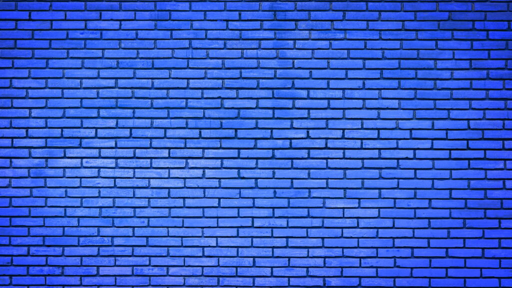 Elegant Deep Blue Brick Wall: A High-Definition Wallpaper Background featuring Stunning Bricks
