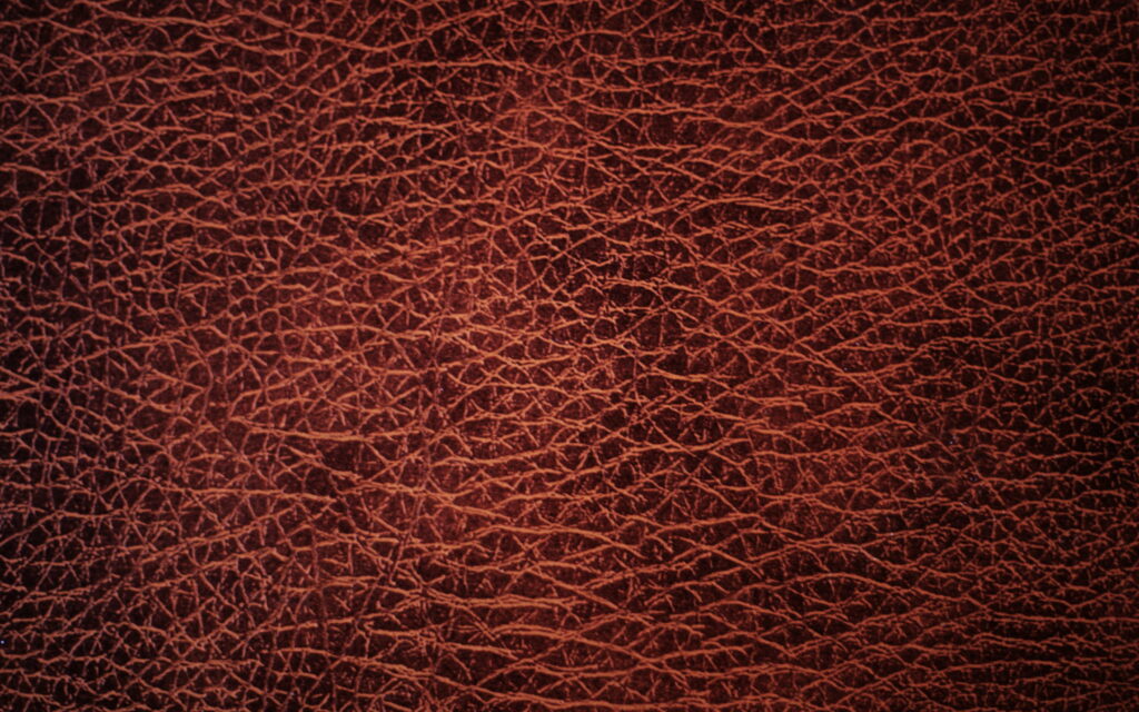 Maroon Leather Macro: Stunning 4K Wallpaper of Textured Leather Backgrounds