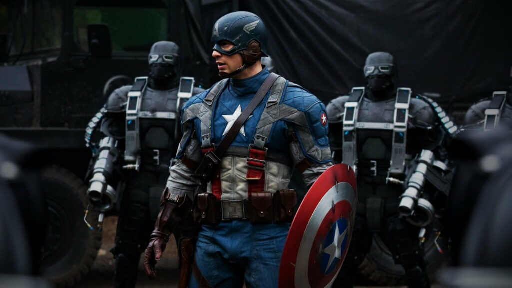 Captain America in WWII suit with shield stands before armed HYDRA soldiers cinematic wallpaper