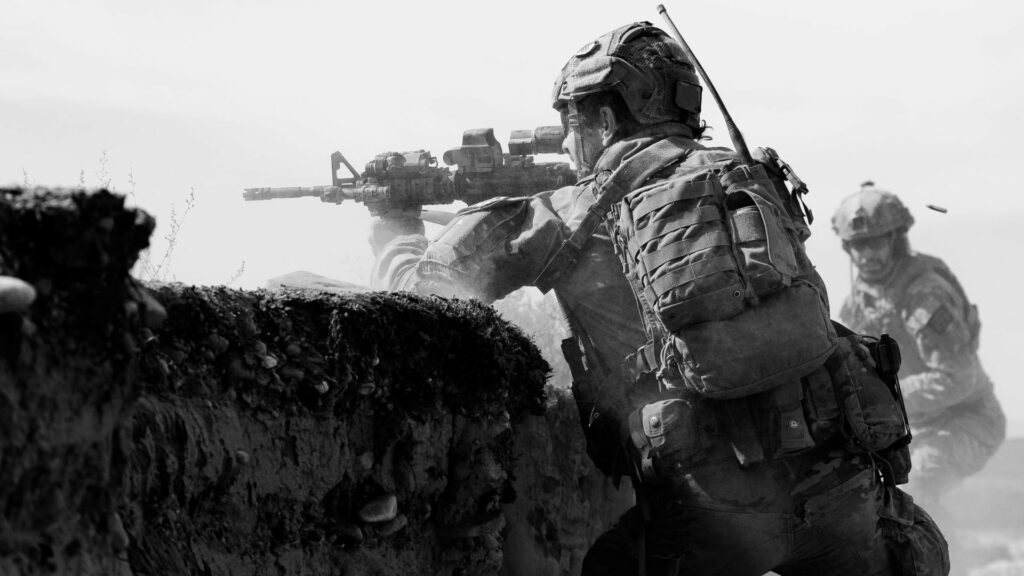 Australian special forces soldier aiming rifle in tactical gear black and white combat wallpaper