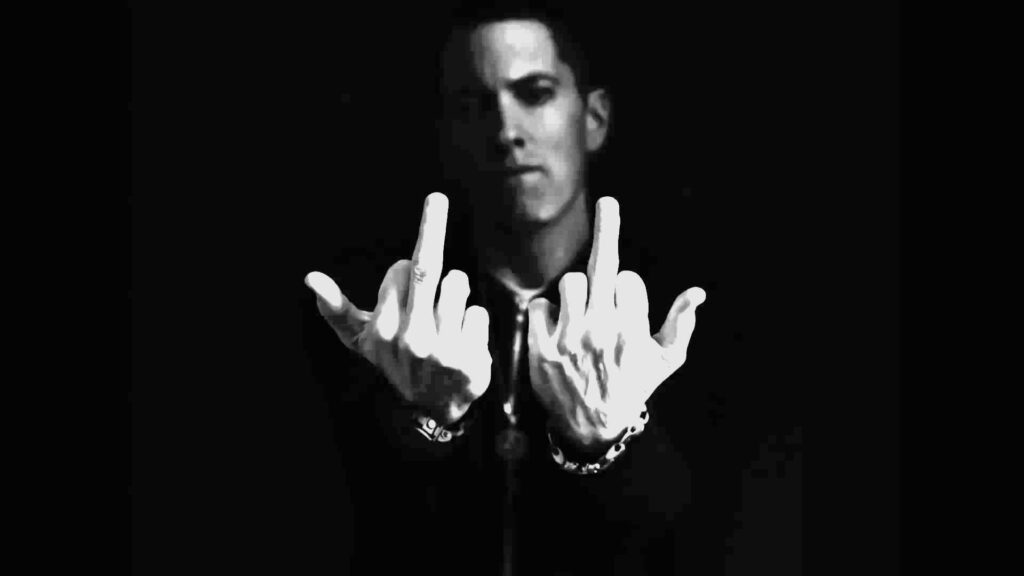 Rebel Eminem Raises Middle Fingers in Intense Monochrome Portrait Wallpaper