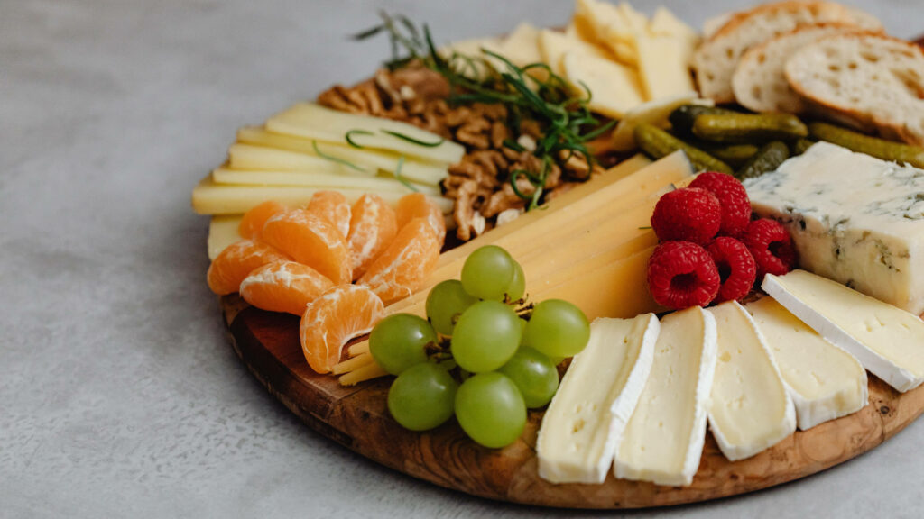 Cheese & Fruit Platter on Rustic Wood: Stunning Wallpaper Background