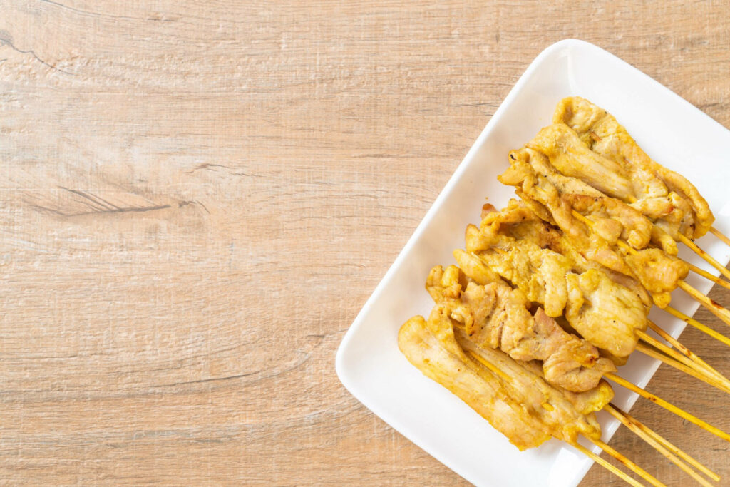 Chicken Satay Wallpaper: Delectable Southeast Asian Dish Background