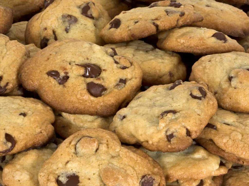 Tempting Display of Gooey Chocolate Chip Cookies in HD Wallpaper