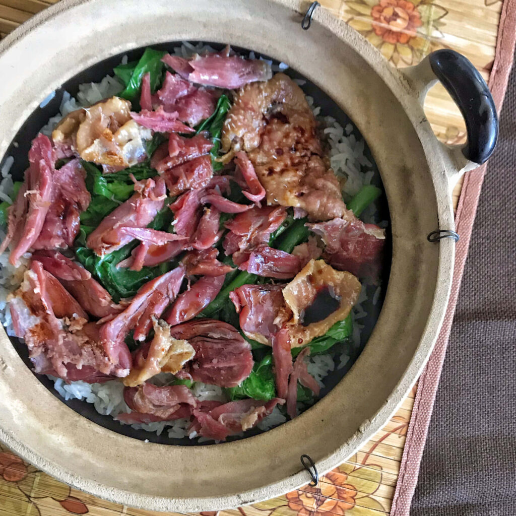 Delectable Claypot Dish: Fragrant Rice & Tender Duck Leg Wallpaper