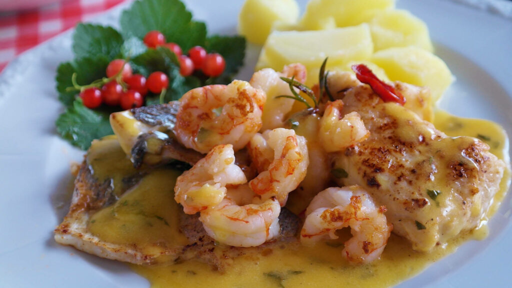 Delectable Fish Fillet & Scampi Shrimp Wallpaper with Creamy Sauce