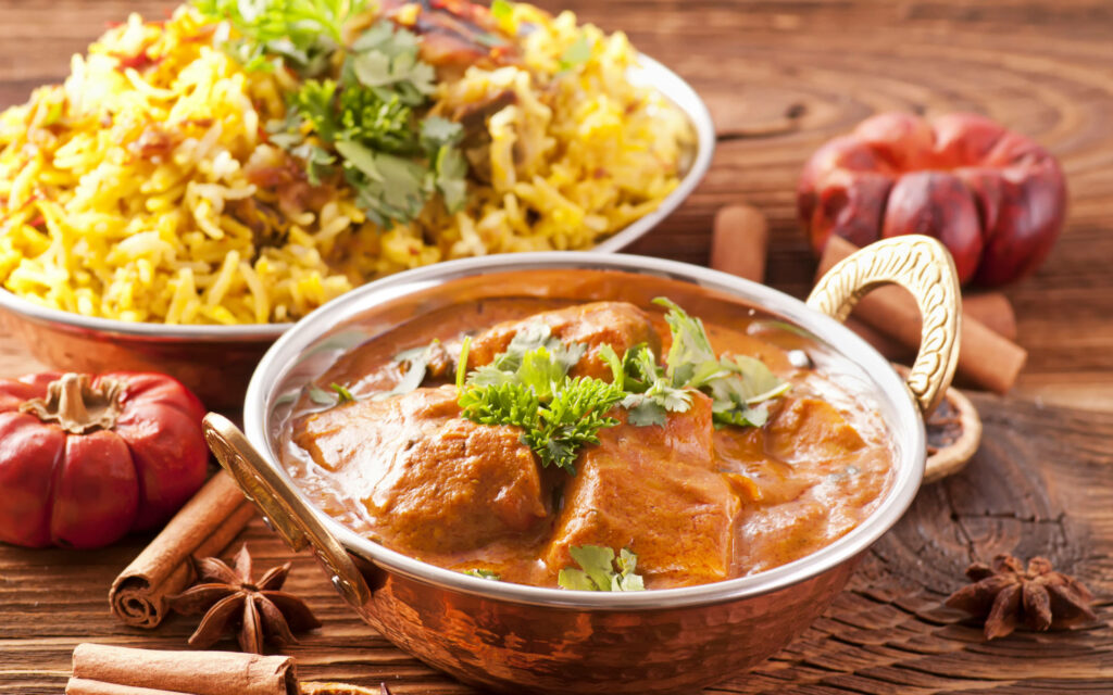 Delectable Indian Lunch Wallpaper: Creamy Butter Chicken & Biryani